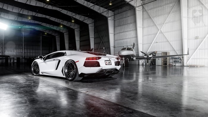 White Lamborghini Aventador in Hangar with Private Jet