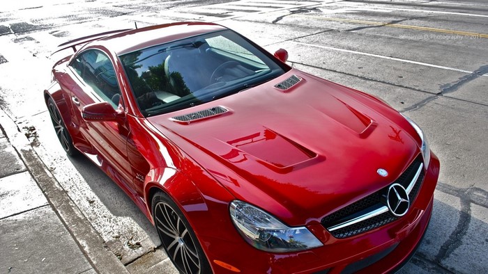 Red Mercedes-Benz SL65 AMG parked on street