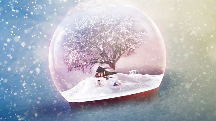 Snow globe with winter scene and tree