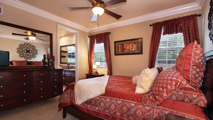Bedroom with dresser and bed