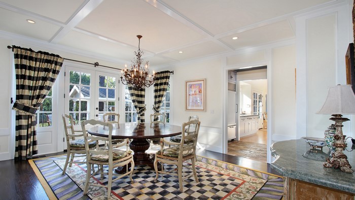 Dining Room with Chandelier and Striped Curtains