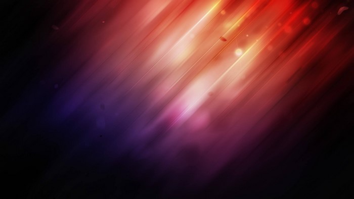 Abstract light streaks in red, purple, and yellow