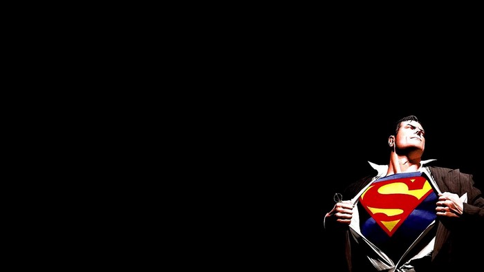 Superman revealing his costume