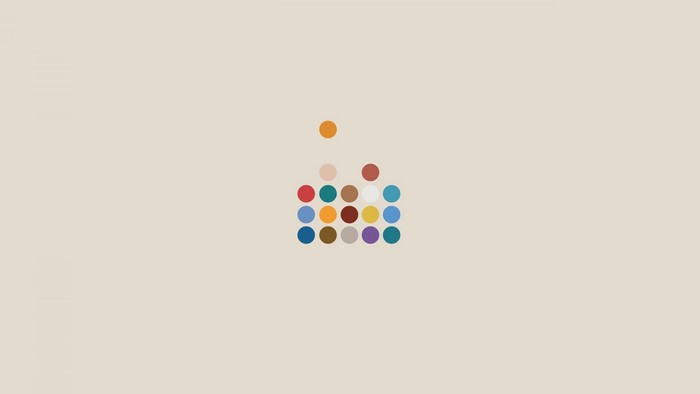Minimalist colorful dots on a plain background