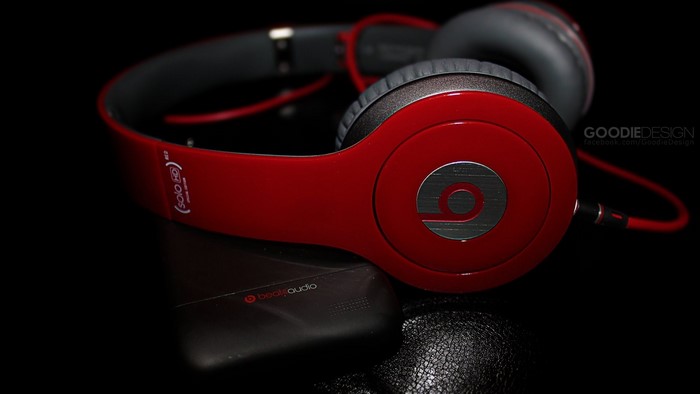 Red Beats Solo HD headphones on a black surface