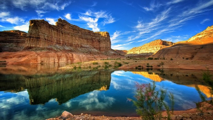 Canyon lake with reflections under a blue sky