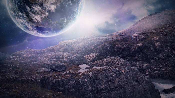 Planet over rocky alien landscape
