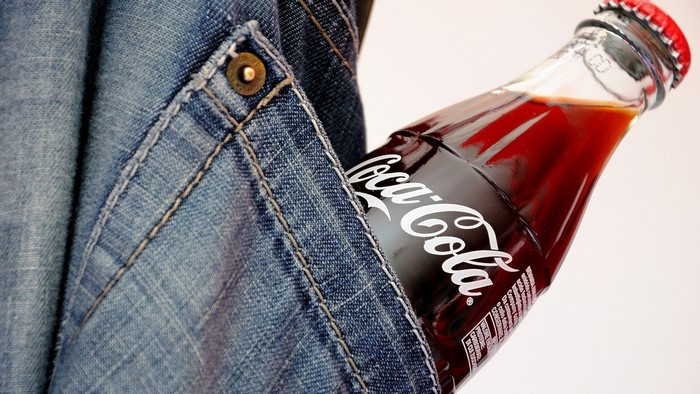 Coca Cola bottle in jeans pocket