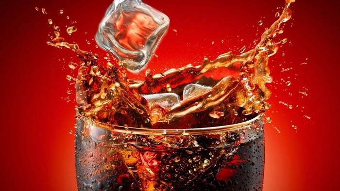 Coca-Cola splash with ice cubes