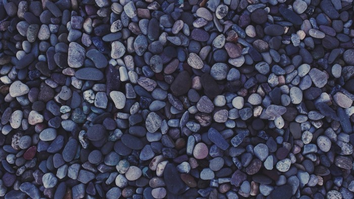 Close-up of dark blue and grey pebbles