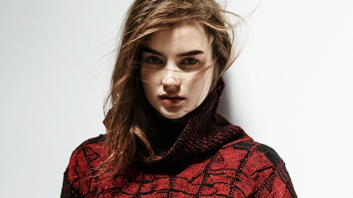 Ali Michael in red and black sweater