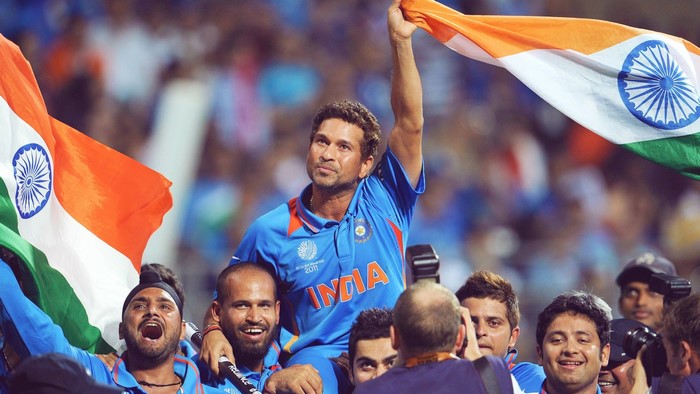 Sachin Tendulkar and Indian Cricket Team celebrating with flag