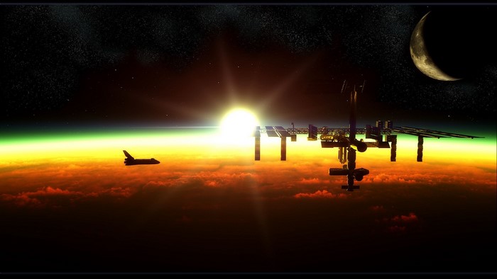 Space Shuttle and ISS orbiting Earth at sunrise