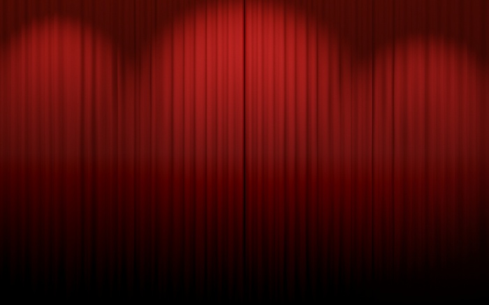 Red theater curtains with spotlights