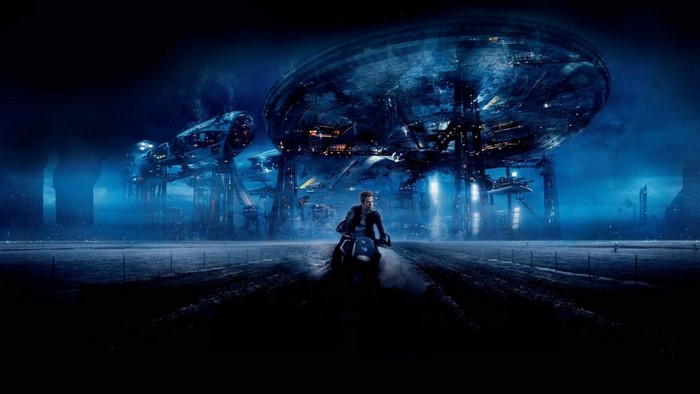 Man on motorcycle in front of alien city
