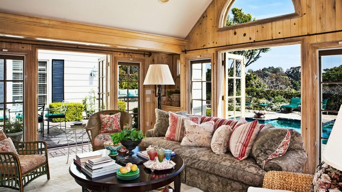 Cozy living room with outdoor pool view