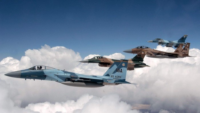 Four fighter jets flying in formation