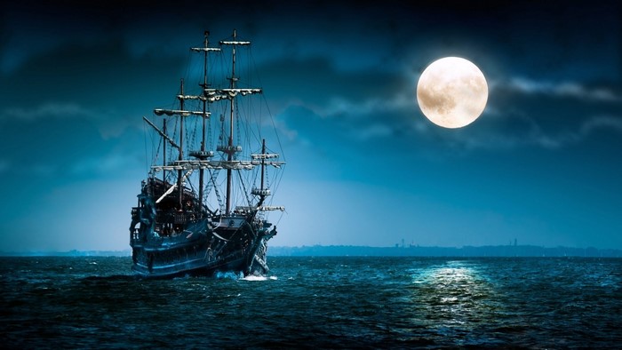 Pirate Ship Sailing Under a Full Moon