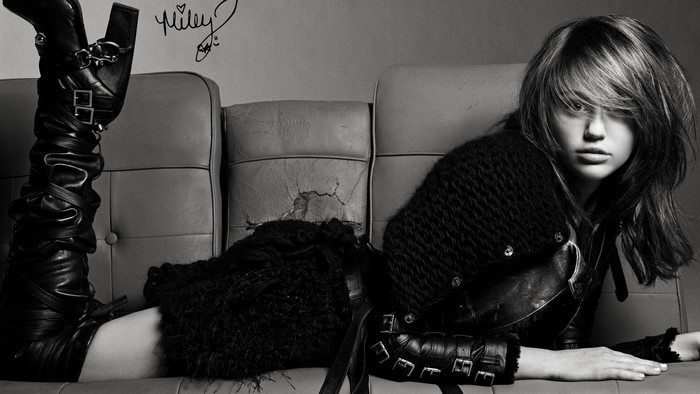 Miley Cyrus on a couch