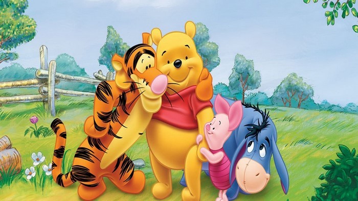 Winnie the Pooh, Tigger, Piglet, and Eeyore in a field