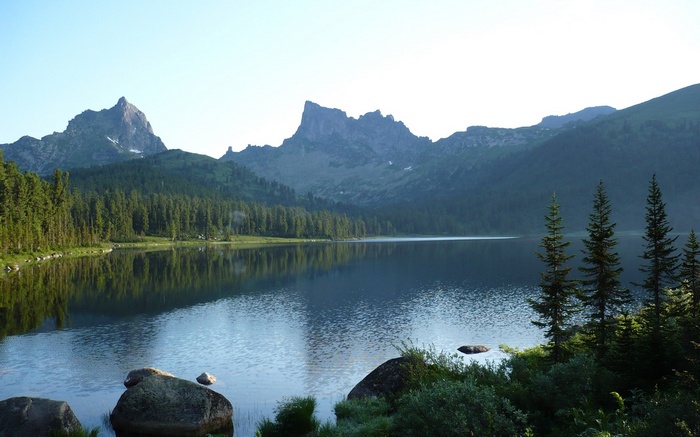 Lake and mountains with pine trees