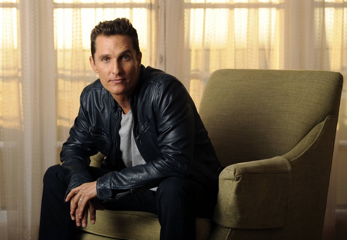 Matthew McConaughey sitting in a chair