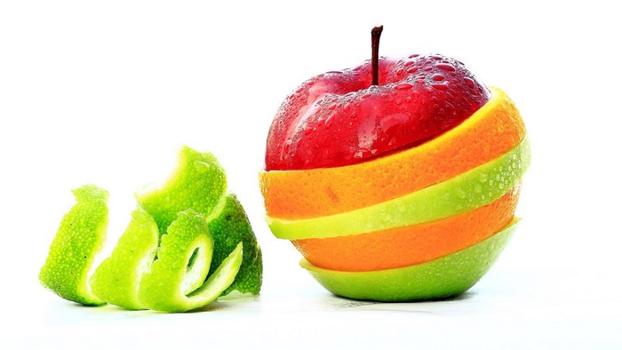 Sliced apple, orange, and lime fruit stack