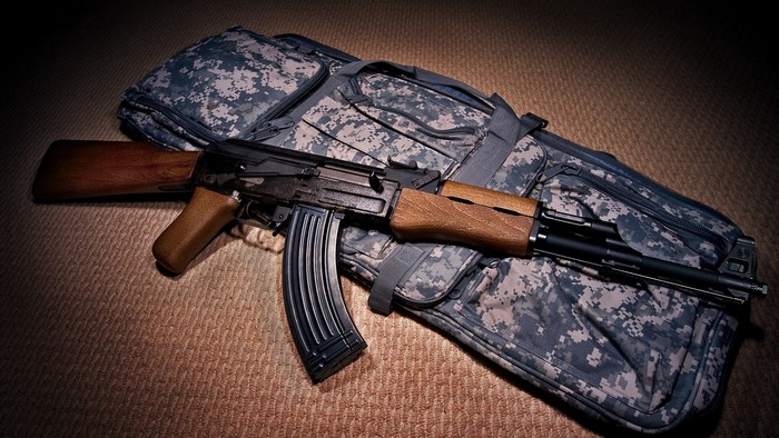 AK-47 rifle on a camouflage gun bag