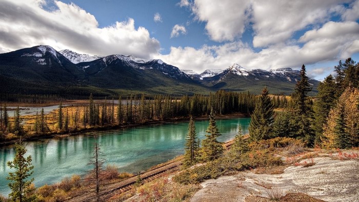 Turquoise river and snow-capped mountains