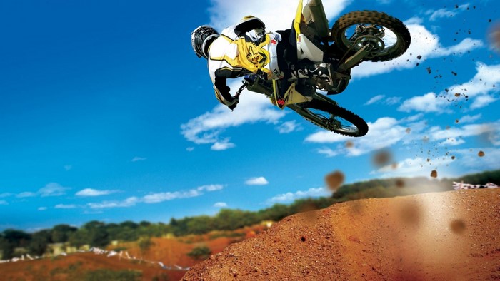 Motocross rider performing a high jump