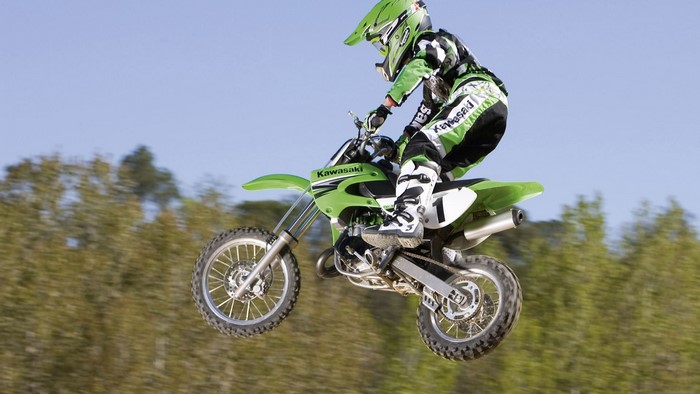 Motocross Rider on Kawasaki Motorcycle in Mid-Air