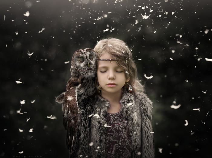 Girl with owl and feathers