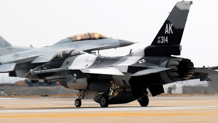 Two Air Force F-16 fighter jets on tarmac
