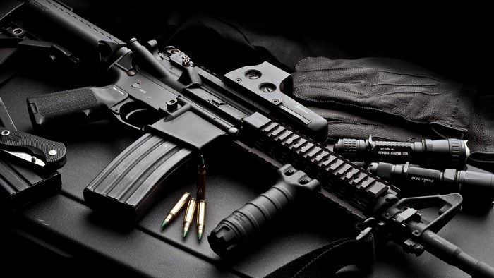 AR-15 rifle with accessories and ammunition