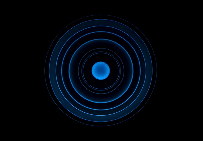 Blue concentric circles with a glowing sphere