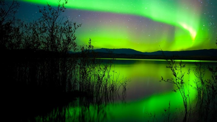 Green Northern Lights over a lake