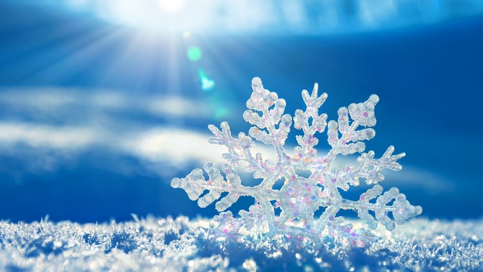 4K Snowflake on Snow with Sun