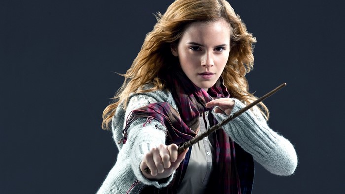 Hermione Granger from Harry Potter holding a wand