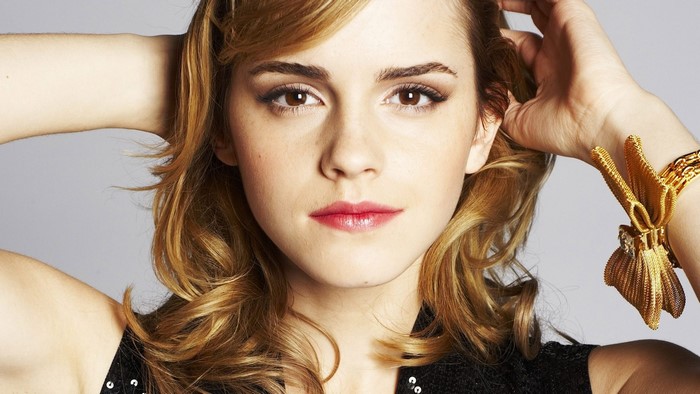 Emma Watson with hands behind her head