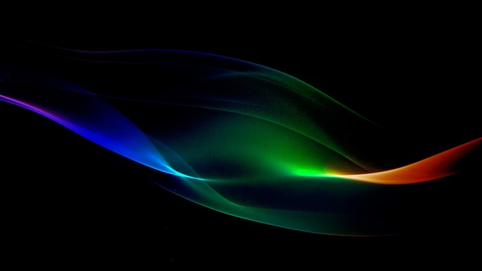 Abstract colorful light streaks on black background