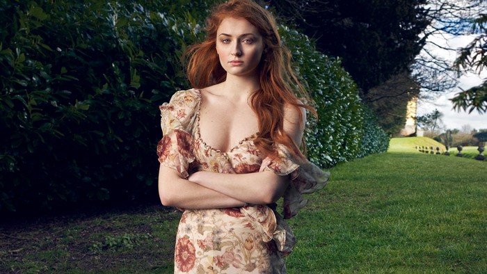 Sophie Turner in a floral dress outdoors