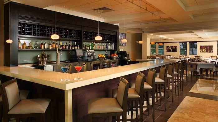 Bar and dining area with tables and chairs