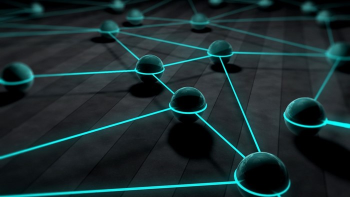 3D network of glowing blue lines connecting spheres