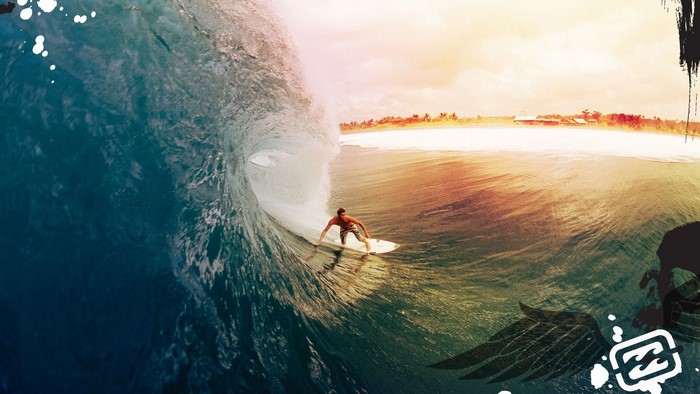Surfer riding a wave in the ocean