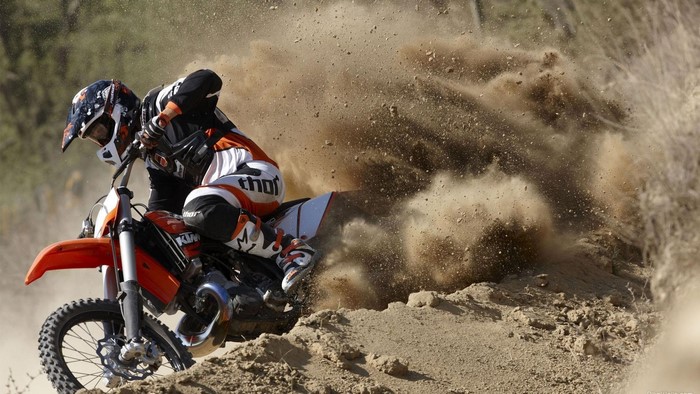 Dirt Bike Rider Kicking Up Dust