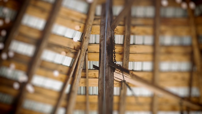 Wooden beams and metal roof of a barn