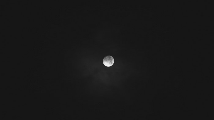 Full moon in a dark sky