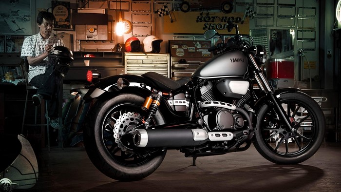 Yamaha XV950R motorcycle in a garage