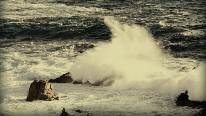 Waves crashing on rocks