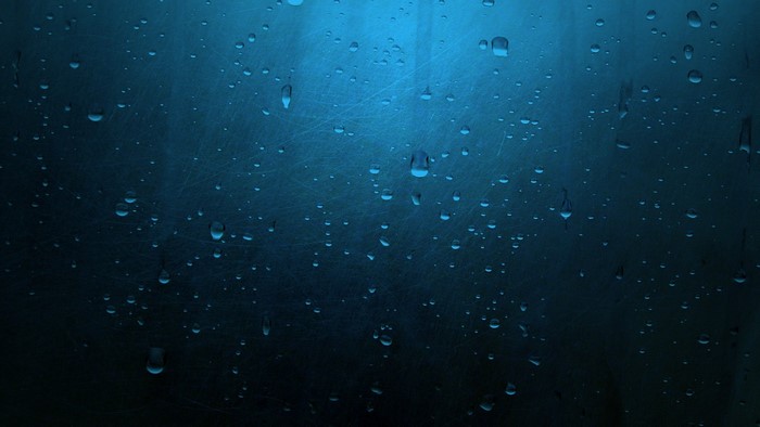 Water Drops on Blue Glass Surface